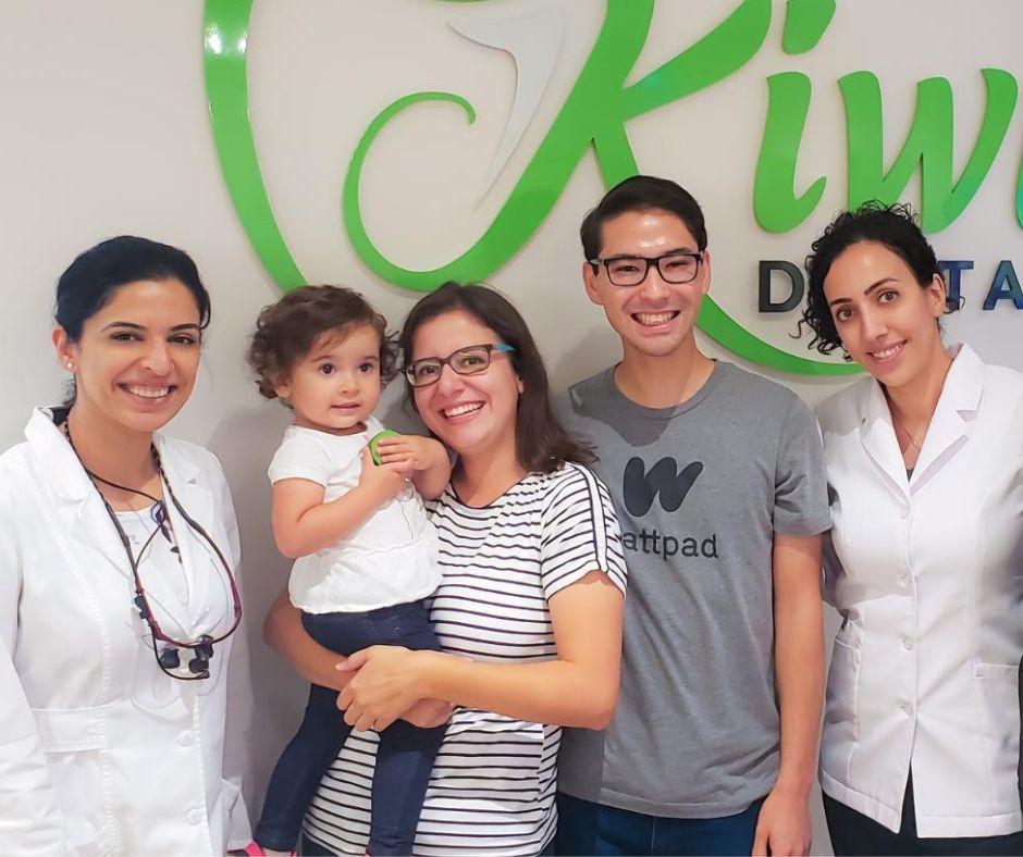 A Kiwi Dental dentist welcoming a family at the clinic